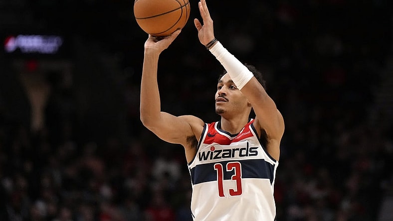 Dec 21, 2023; Portland, Oregon, USA; Washington Wizards shooting guard Jordan Poole (13) shoots the ball during the first half against the Portland Trail Blazers at Moda Center. Mandatory Credit: Soobum Im-USA TODAY Sports