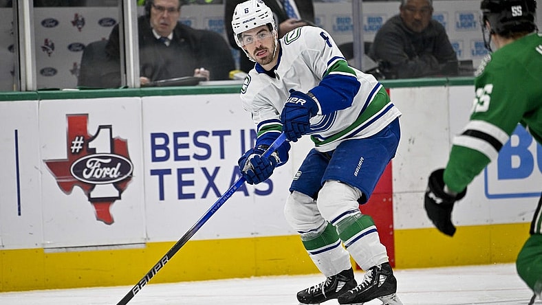 Dec 21, 2023; Dallas, Texas, USA; Vancouver Canucks right wing Conor Garland (8) skates against the Dallas Stars during the third period at the American Airlines Center. Mandatory Credit: Jerome Miron-USA TODAY Sports
