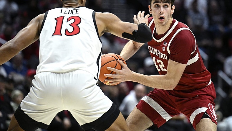 Dec 21, 2023; San Diego, California, USA; Stanford Cardinal forward Maxime Raynaud (42) looks to pass defended by San Diego State Aztecs forward Jaedon LeDee (13) during the second half at Viejas Arena. Mandatory Credit: Orlando Ramirez-USA TODAY Sports