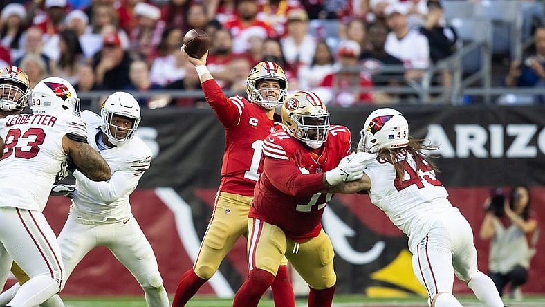 Dec 17, 2023; Glendale, Arizona, USA; San Francisco 49ers offensive lineman Trent Williams (71) blocks for quarterback Brock Purdy (13) against Arizona Cardinals linebacker Dennis Gardeck (45) at State Farm Stadium. Mandatory Credit: Mark J. Rebilas-USA TODAY Sports