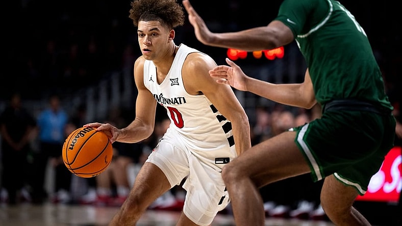 Cincinnati Bearcats guard Dan Skillings Jr. (0) drives to the basket in the first half of the basketball game between Cincinnati Bearcats and Stetson Hatters at Fifth Third Arena in Cincinnati on Friday, Dec. 22, 2023.