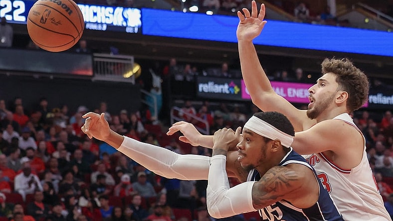 Dec 22, 2023; Houston, Texas, USA; Houston Rockets center Alperen Sengun (28) and Dallas Mavericks forward Richaun Holmes (20) reach for a rebound in the second quarter at Toyota Center. Mandatory Credit: Thomas Shea-USA TODAY Sports