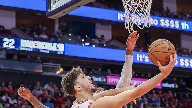 Dec 22, 2023; Houston, Texas, USA; Houston Rockets center Alperen Sengun (28) scores against Dallas Mavericks forward Markieff Morris (88) in the second quarter at Toyota Center. Mandatory Credit: Thomas Shea-USA TODAY Sports