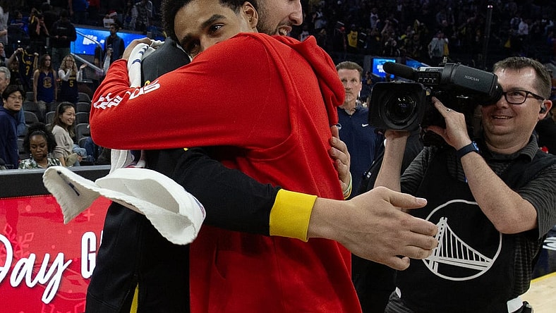 Dec 22, 2023; San Francisco, California, USA; Golden State Warriors guard Klay Thompson (left) embraces former teammate Washington Wizards guard Jordan Poole following their game at Chase Center. Mandatory Credit: D. Ross Cameron-USA TODAY Sports