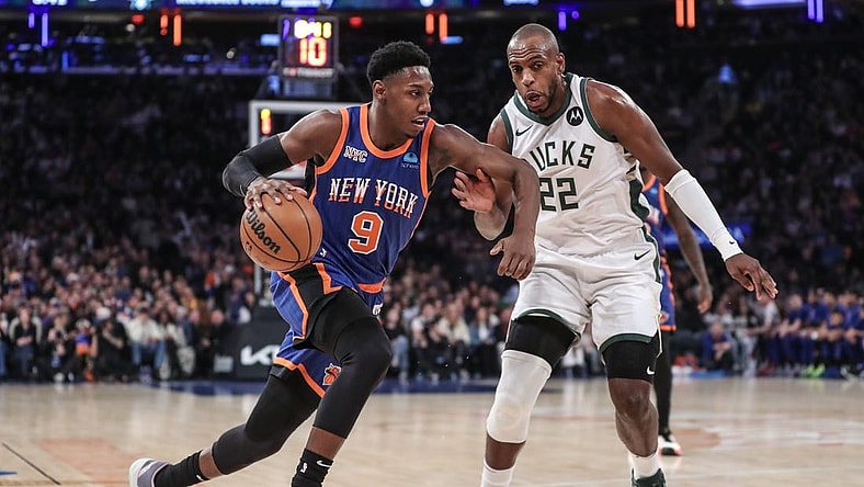 Dec 23, 2023; New York, New York, USA;  New York Knicks guard RJ Barrett (9) drives past Milwaukee Bucks forward Khris Middleton (22) in the first quarter at Madison Square Garden. Mandatory Credit: Wendell Cruz-USA TODAY Sports