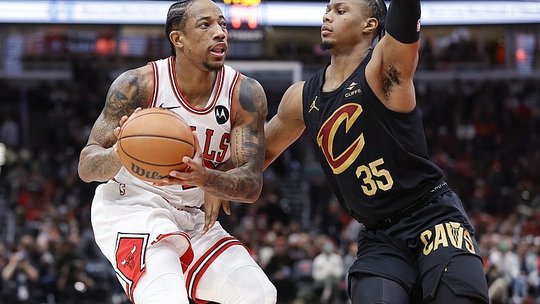 Dec 23, 2023; Chicago, Illinois, USA; Chicago Bulls forward DeMar DeRozan (11) drives to the basket against Cleveland Cavaliers forward Isaac Okoro (35) during the first half at United Center. Mandatory Credit: Kamil Krzaczynski-USA TODAY Sports