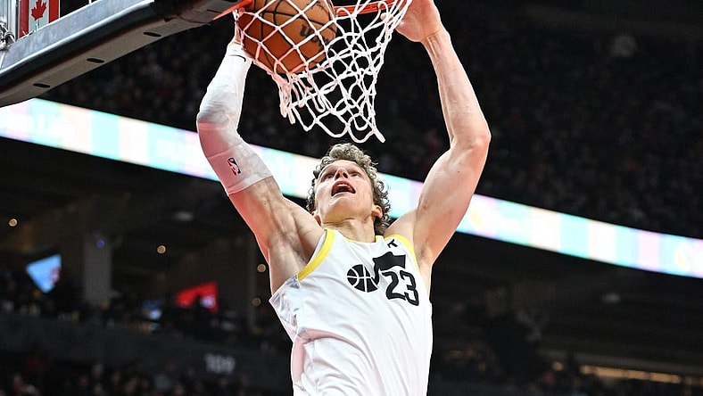 Dec 23, 2023; Toronto, Ontario, CAN;  Utah Jazz forward Lauri Markkanen (23) dunks for a basket against the Toronto Raptors in the second half at Scotiabank Arena. Mandatory Credit: Dan Hamilton-USA TODAY Sports