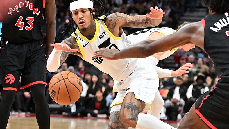 Dec 23, 2023; Toronto, Ontario, CAN;  Utah Jazz guard Jordan Clarkson (00) pursues a loose ball against the Toronto Raptors in the second half at Scotiabank Arena. Mandatory Credit: Dan Hamilton-USA TODAY Sports