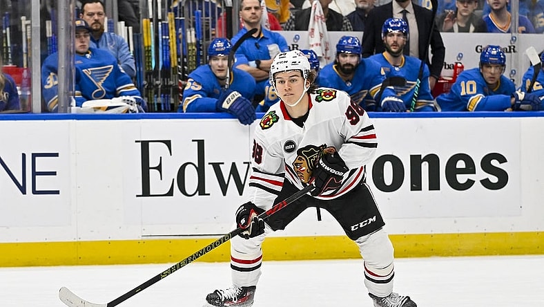 Dec 23, 2023; St. Louis, Missouri, USA;  Chicago Blackhawks center Connor Bedard (98) controls the puck against the St. Louis Blues during the first period at Enterprise Center. Mandatory Credit: Jeff Curry-USA TODAY Sports