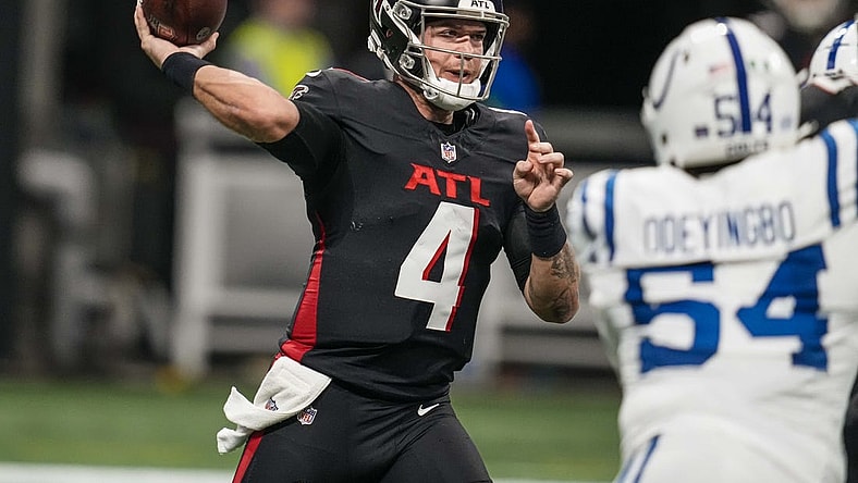 Dec 24, 2023; Atlanta, Georgia, USA; Atlanta Falcons quarterback Taylor Heinicke (4) passes the ball against the Indianapolis Colts during the first half at Mercedes-Benz Stadium. Mandatory Credit: Dale Zanine-USA TODAY Sports