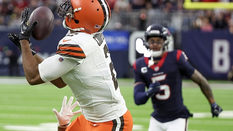 Dec 24, 2023; Houston, Texas, USA; Cleveland Browns wide receiver Amari Cooper (2) catches a touchdown pass with Houston Texans safety Jalen Pitre (5) chasing in the second quarter at NRG Stadium. Mandatory Credit: Thomas Shea-USA TODAY Sports