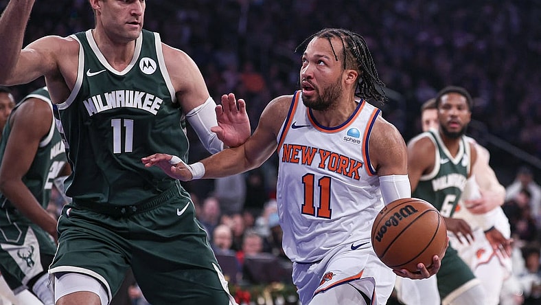 Dec 25, 2023; New York, New York, USA; New York Knicks guard Jalen Brunson (11) drives to the basket against Milwaukee Bucks center Brook Lopez (11) during the first quarter at Madison Square Garden. Mandatory Credit: Vincent Carchietta-USA TODAY Sports