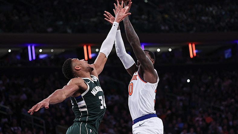 Dec 25, 2023; New York, New York, USA; New York Knicks forward Julius Randle (30) shoots the ball as Milwaukee Bucks forward Giannis Antetokounmpo (34) defends during the first half at Madison Square Garden. Mandatory Credit: Vincent Carchietta-USA TODAY Sports