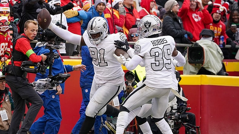 Dec 25, 2023; Kansas City, Missouri, USA; Las Vegas Raiders defensive tackle Bilal Nichols (91) scores against the Kansas City Chiefs after picking up a fumble during the first half at GEHA Field at Arrowhead Stadium. Mandatory Credit: Denny Medley-USA TODAY Sports