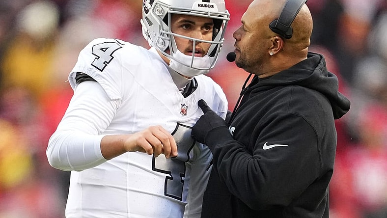 Dec 25, 2023; Kansas City, Missouri, USA; Las Vegas Raiders quarterback Aidan O'Connell (4) talks with head coach Antonio Pierce during the second half against the Las Vegas Raiders at GEHA Field at Arrowhead Stadium. Mandatory Credit: Jay Biggerstaff-USA TODAY Sports