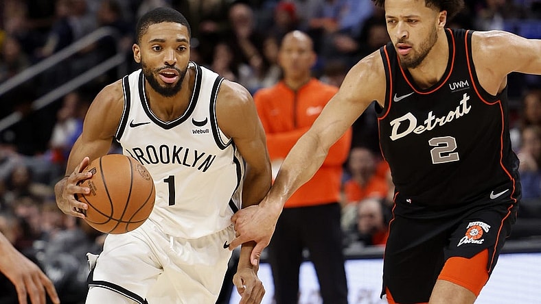 Dec 26, 2023; Detroit, Michigan, USA; Brooklyn Nets forward Mikal Bridges (1) dribbles while defended by Detroit Pistons guard Cade Cunningham (2) in the second half at Little Caesars Arena. Mandatory Credit: Rick Osentoski-USA TODAY Sports