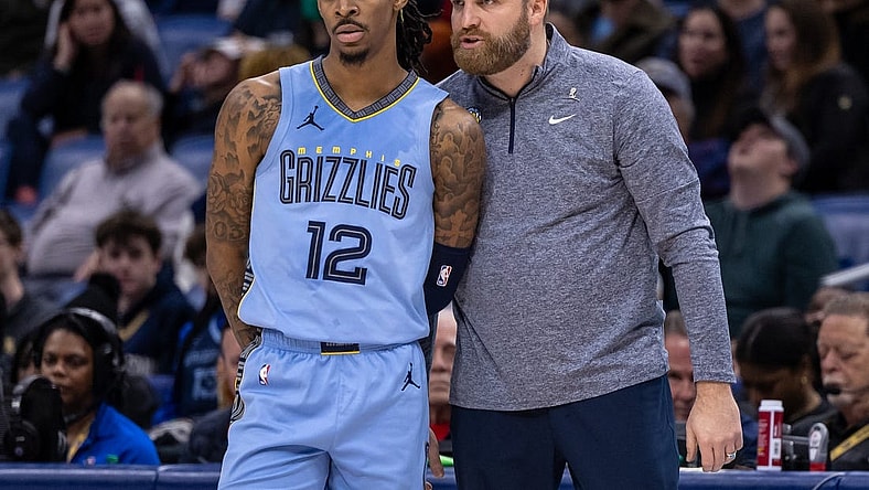 Dec 26, 2023; New Orleans, Louisiana, USA; Memphis Grizzlies head coach Taylor Jenkins talks with guard Ja Morant (12) in the second half against the New Orleans Pelicans at the Smoothie King Center. Mandatory Credit: Stephen Lew-USA TODAY Sports