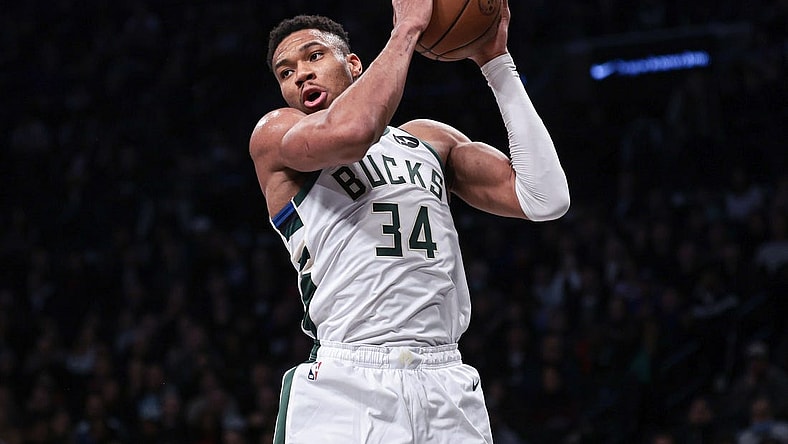 Dec 27, 2023; Brooklyn, New York, USA; Milwaukee Bucks forward Giannis Antetokounmpo (34) rebounds during the first quarter against the Brooklyn Nets at Barclays Center. Mandatory Credit: Vincent Carchietta-USA TODAY Sports