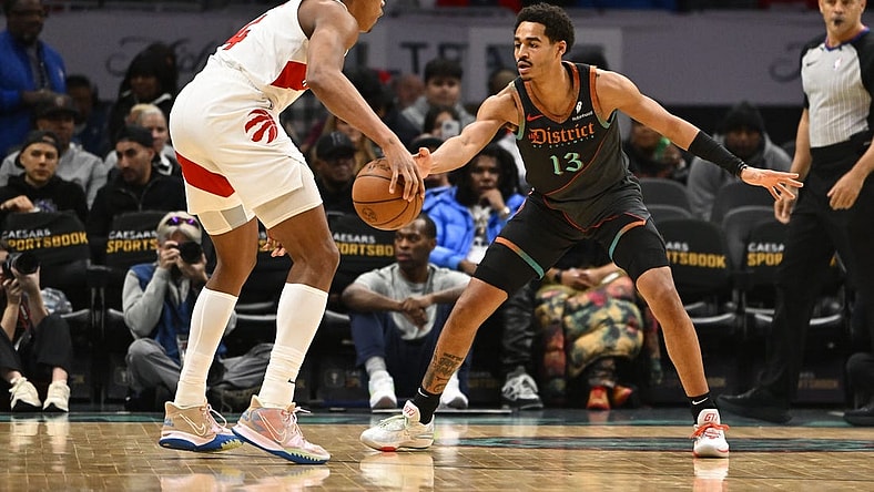 Dec 27, 2023; Washington, District of Columbia, USA; Washington Wizards guard Jordan Poole (13) defends Toronto Raptors forward Scottie Barnes (4) during the first half at Capital One Arena. Mandatory Credit: Brad Mills-USA TODAY Sports