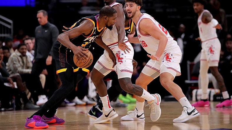 Dec 27, 2023; Houston, Texas, USA; Phoenix Suns forward Kevin Durant (35) handles the ball against Houston Rockets center Alperen Sengun (28) during the second quarter at Toyota Center. Mandatory Credit: Erik Williams-USA TODAY Sports
