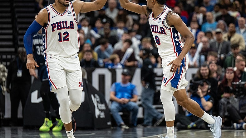 Dec 27, 2023; Orlando, Florida, USA; Philadelphia 76ers forward Tobias Harris (12) and small guard De'Anthony Melton (8) celebrate a turnover against the Orlando Magic in the fourth quarter at Kia Center. Mandatory Credit: Jeremy Reper-USA TODAY Sports