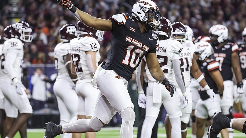 Dec 27, 2023; Houston, TX, USA; Oklahoma State Cowboys wide receiver Rashod Owens (10) celebrates after scoring a touchdown during the first quarter against the Texas A&M Aggies at NRG Stadium. Mandatory Credit: Troy Taormina-USA TODAY Sports