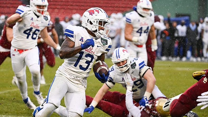 Dec 28, 2023; Boston, MA, USA; Southern Methodist Mustangs wide receiver Roderick Daniels Jr. (13) runs the ball against the Boston College Eagles during the first half at Fenway Park. Mandatory Credit: Eric Canha-USA TODAY Sports