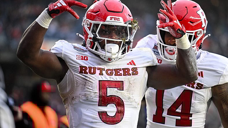 Dec 28, 2023; Bronx, NY, USA; Rutgers Scarlet Knights running back Kyle Monangai (5) celebrates his touchdown against Miami Hurricanes during the second quarter with Rutgers Scarlet Knights wide receiver Isaiah Washington (14) at Yankee Stadium. Mandatory Credit: Mark Smith-USA TODAY Sports