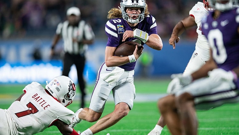 Dec 28, 2023; Orlando, FL, USA; Kansas State quarterback Avery Johnson (2) runs for the touchdown against NC State in the second quarter at Camping World Stadium. Mandatory Credit: Jeremy Reper-USA TODAY Sports