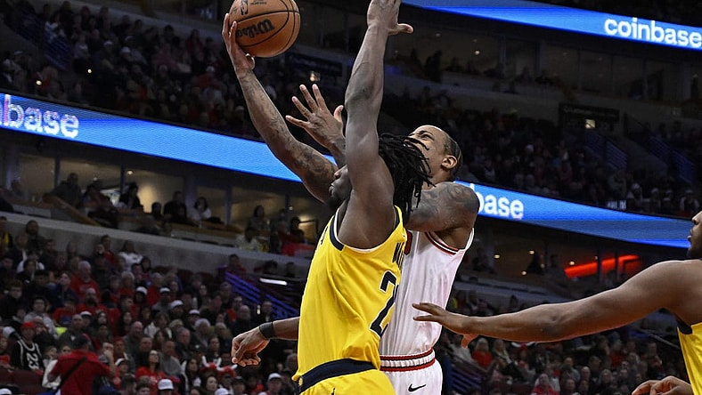 Dec 28, 2023; Chicago, Illinois, USA;  Chicago Bulls forward DeMar DeRozan (11) shoots against Indiana Pacers forward Aaron Nesmith (23)  during the first half at United Center. Mandatory Credit: Matt Marton-USA TODAY Sports