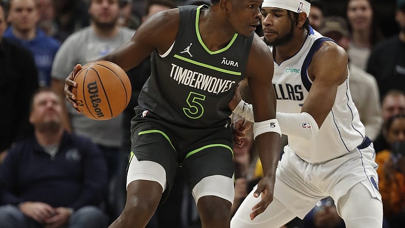 Dec 28, 2023; Minneapolis, Minnesota, USA; Minnesota Timberwolves guard Anthony Edwards (5) works around Dallas Mavericks guard Jaden Hardy (1) in the first quarter at Target Center. Mandatory Credit: Bruce Kluckhohn-USA TODAY Sports