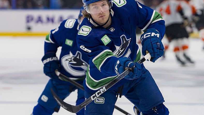 Dec 28, 2023; Vancouver, British Columbia, CAN; Vancouver Canucks forward Brock Boeser (6) shoots during warm up prior to a game against the Philadelphia Flyers at Rogers Arena. Mandatory Credit: Bob Frid-USA TODAY Sports