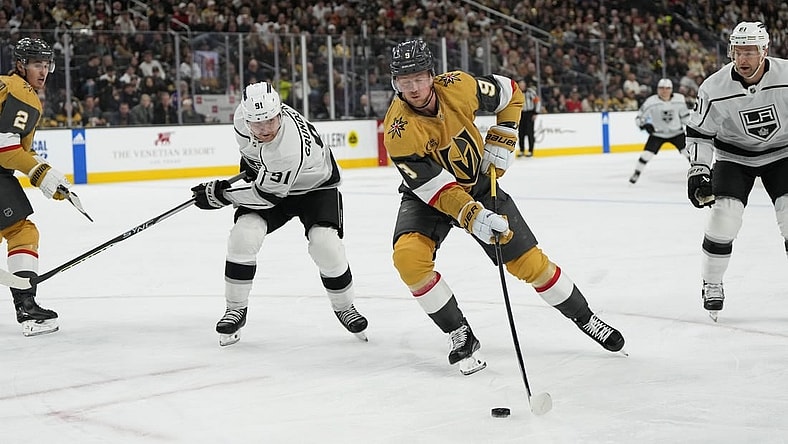 Dec 28, 2023; Las Vegas, Nevada, USA; Vegas Golden Knights center Jack Eichel (9) skates with the puck against Los Angeles Kings right wing Carl Grundstrom (91) during the first period at T-Mobile Arena. Mandatory Credit: Lucas Peltier-USA TODAY Sports