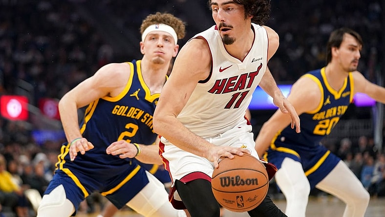 Dec 28, 2023; San Francisco, California, USA; Miami Heat forward Jaime Jaquez Jr. (11) spins towards the hoop next to Golden State Warriors guard Brandin Podziemski (2) in the first quarter at the Chase Center. Mandatory Credit: Cary Edmondson-USA TODAY Sports