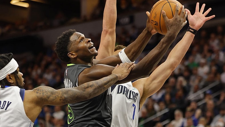 Dec 28, 2023; Minneapolis, Minnesota, USA; Dallas Mavericks guard Jaden Hardy (1) fouls Minnesota Timberwolves guard Anthony Edwards (5) as he goes to the basket in the third quarter at Target Center. Mandatory Credit: Bruce Kluckhohn-USA TODAY Sports