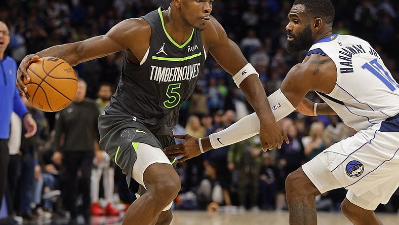 Dec 28, 2023; Minneapolis, Minnesota, USA; Minnesota Timberwolves guard Anthony Edwards (5) works against Dallas Mavericks guard Tim Hardaway Jr. (10) in the fourth quarter at Target Center. Mandatory Credit: Bruce Kluckhohn-USA TODAY Sports