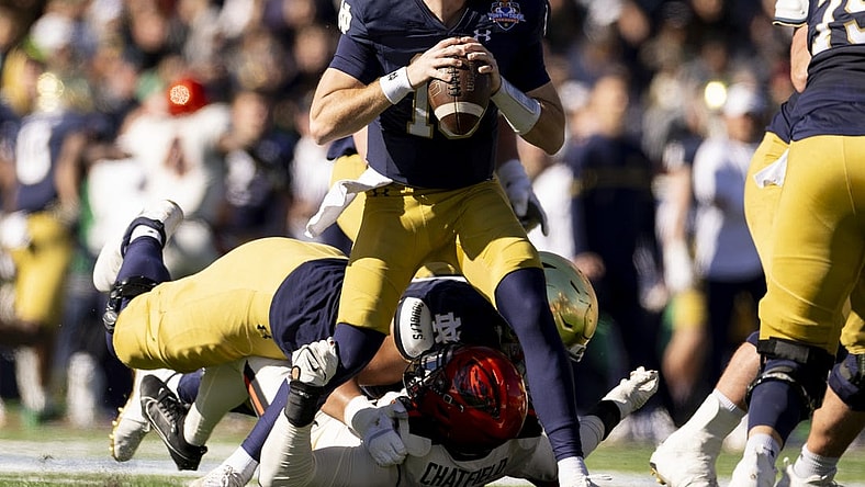 Dec 29, 2023; El Paso, TX, USA; Notre Dame Fighting Irish quarterback Steve Angeli (18) drops back to pass against the Oregon State Beavers defense in the first half at Sun Bowl Stadium. Mandatory Credit: Ivan Pierre Aguirre-USA TODAY Sports