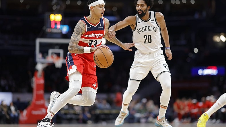 Dec 29, 2023; Washington, District of Columbia, USA; Washington Wizards forward Kyle Kuzma (33) drives to the basket as Brooklyn Nets guard Spencer Dinwiddie (26) defends in the first quarter at Capital One Arena. Mandatory Credit: Geoff Burke-USA TODAY Sports