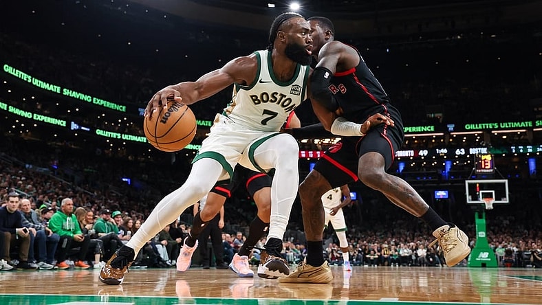Dec 29, 2023; Boston, Massachusetts, USA; Boston Celtics forward Jaylen Brown (7) drives to the basket during the first half against the Toronto Raptors at TD Garden. Mandatory Credit: Paul Rutherford-USA TODAY Sports