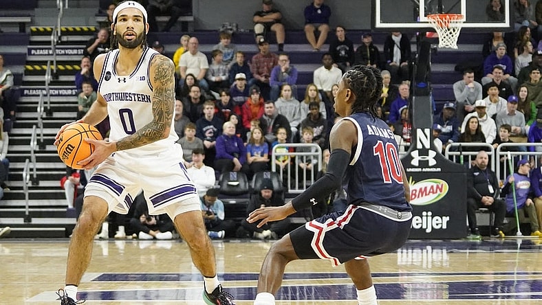 Dec 29, 2023; Evanston, Illinois, USA; Jackson State Tigers guard Chase Adams (10) defends Northwestern Wildcats guard Boo Buie (0) during the first half at Welsh-Ryan Arena. Mandatory Credit: David Banks-USA TODAY Sports