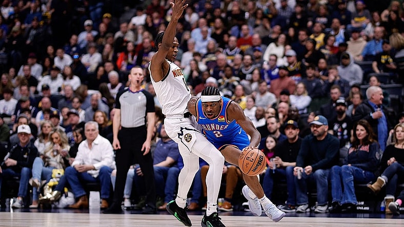 Dec 29, 2023; Denver, Colorado, USA; Oklahoma City Thunder guard Shai Gilgeous-Alexander (2) drives to the basket against Denver Nuggets forward Peyton Watson (8) in the second quarter at Ball Arena. Mandatory Credit: Isaiah J. Downing-USA TODAY Sports