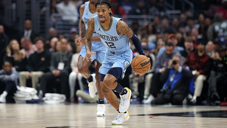 Dec 29, 2023; Los Angeles, California, USA;  Memphis Grizzlies guard Ja Morant (12) dribbles the ball during the first quarter against the Los Angeles Clippers at Crypto.com Arena. Mandatory Credit: Kiyoshi Mio-USA TODAY Sports