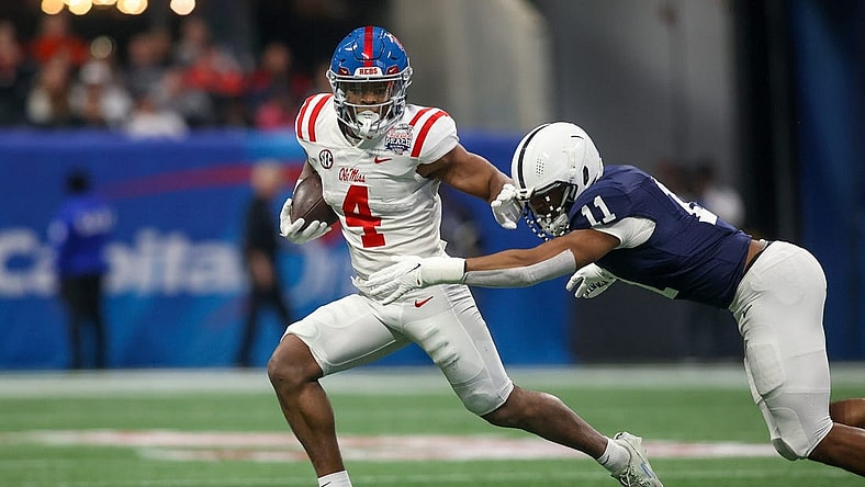 Dec 30, 2023; Atlanta, GA, USA; Mississippi Rebels running back Quinshon Judkins (4) is tackled by Penn State Nittany Lions linebacker Abdul Carter (11) in the first quarter at Mercedes-Benz Stadium. Mandatory Credit: Brett Davis-USA TODAY Sports