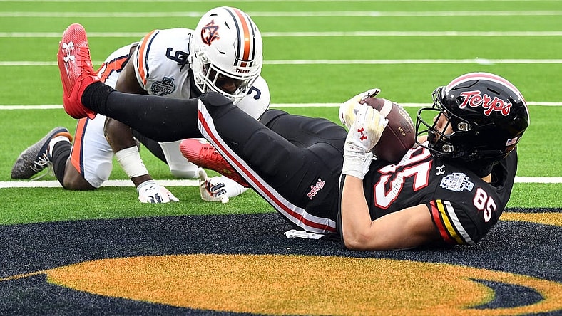 Dec 30, 2023; Nashville, TN, USA; Maryland Terrapins tight end Preston Howard (85) catches a touchdown pass against Auburn Tigers linebacker Eugene Asante (9) during the first half at Nissan Stadium. Mandatory Credit: Christopher Hanewinckel-USA TODAY Sports