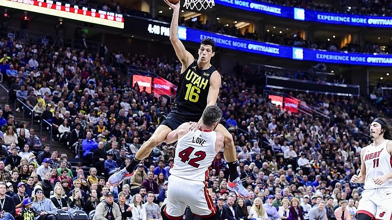 Dec 31, 2022; Salt Lake City, Utah, USA; Utah Jazz forward Simone Fontecchio (16) gets fouled by Miami Heat forward/center Kevin Love (42) during the second half at Vivint Arena. Mandatory Credit: Christopher Creveling-USA TODAY Sports