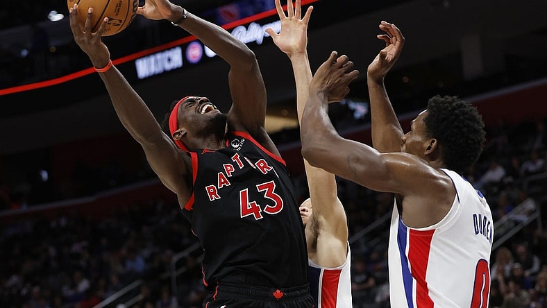 Dec 30, 2023; Detroit, Michigan, USA;  Toronto Raptors forward Pascal Siakam (43) shoots on Detroit Pistons center Jalen Duren (0) in the second half at Little Caesars Arena. Mandatory Credit: Rick Osentoski-USA TODAY Sports