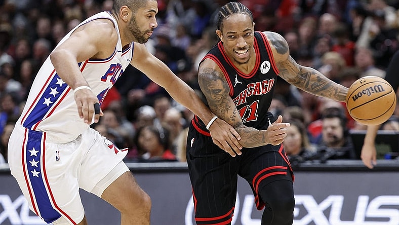Dec 30, 2023; Chicago, Illinois, USA; Chicago Bulls forward DeMar DeRozan (11) drives to the basket against Philadelphia 76ers forward Nicolas Batum (40) during the first half at United Center. Mandatory Credit: Kamil Krzaczynski-USA TODAY Sports