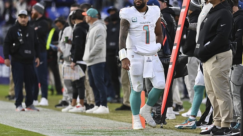 Dec 31, 2023; Baltimore, Maryland, USA;  Miami Dolphins quarterback Tua Tagovailoa (1) walks down the sidelines during the second half against the Baltimore Ravens at M&T Bank Stadium.Baltimore Ravens defeated Miami Dolphins 56-19. Mandatory Credit: Tommy Gilligan-USA TODAY Sports
