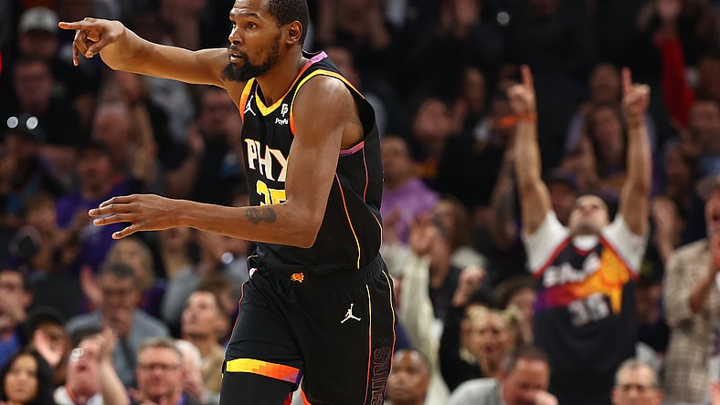 Kevin Durant reacts after hitting a 3-point shot.
