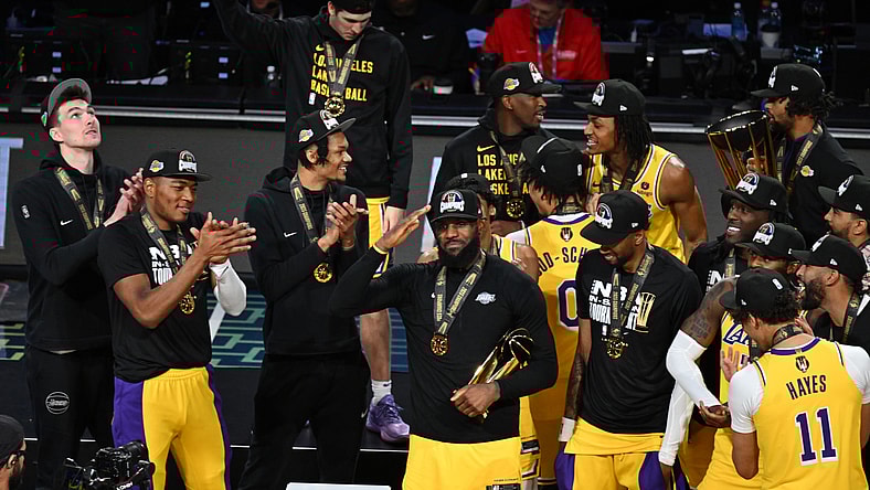 NBA In-Season Tournament: LeBron James holds up the MVP trophy.